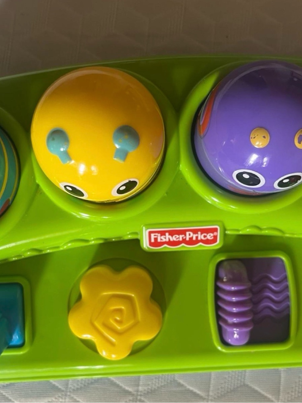 Fisher-Price Green Base Activity Toy with Yellow and Purple Pop-Up Characters